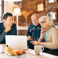 Senior couple look over their group life insurance policy