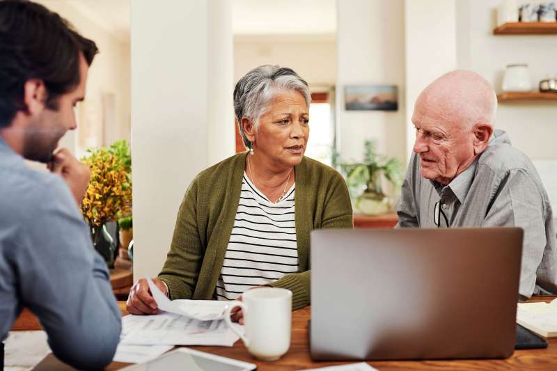 Senior couple meet with advisor about life insurance