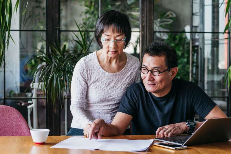Older couple look over life insurance options together