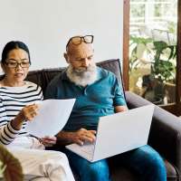 Couple looking at life insurance policies