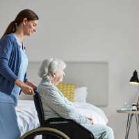 Senior in nursing home receiving care