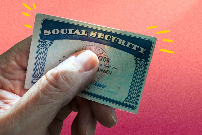 Close-up of a hand holding a social security card