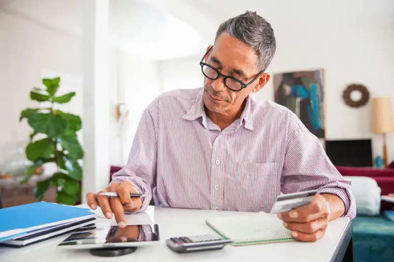 Man looks at his credit financials.