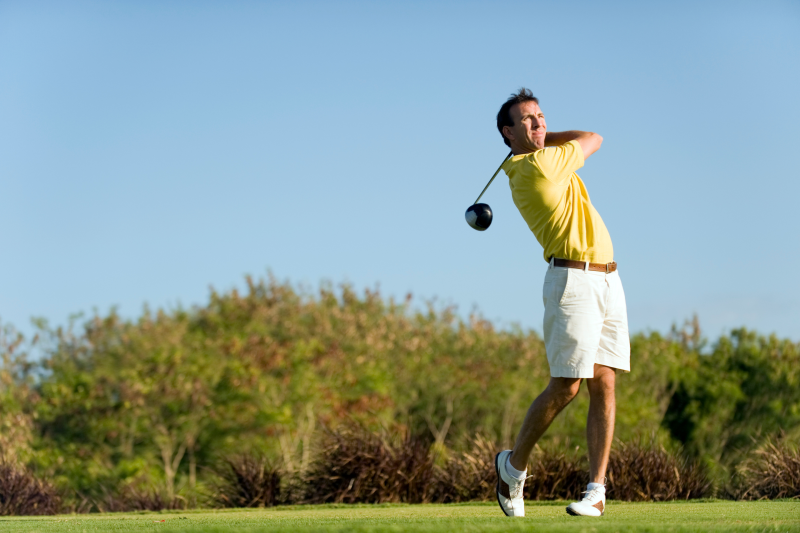 Golfer playing off a tee during a round of golf