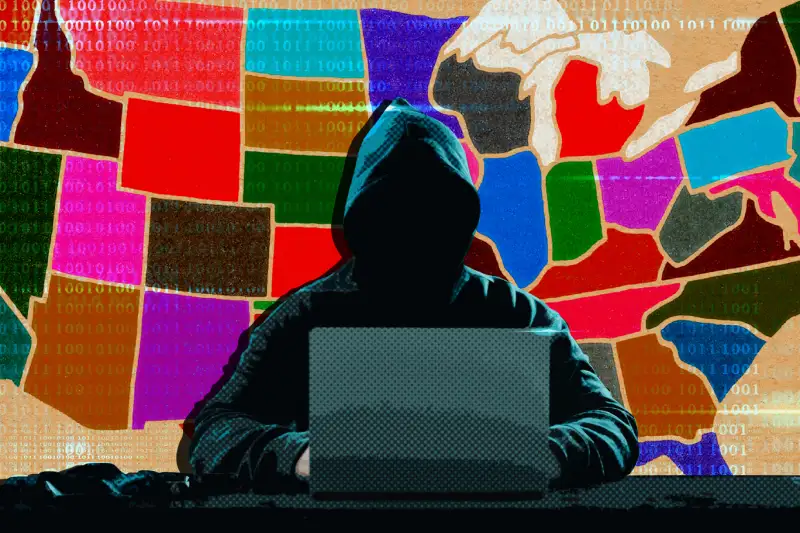 The US states in the background with a scammer sitting in front of a laptop