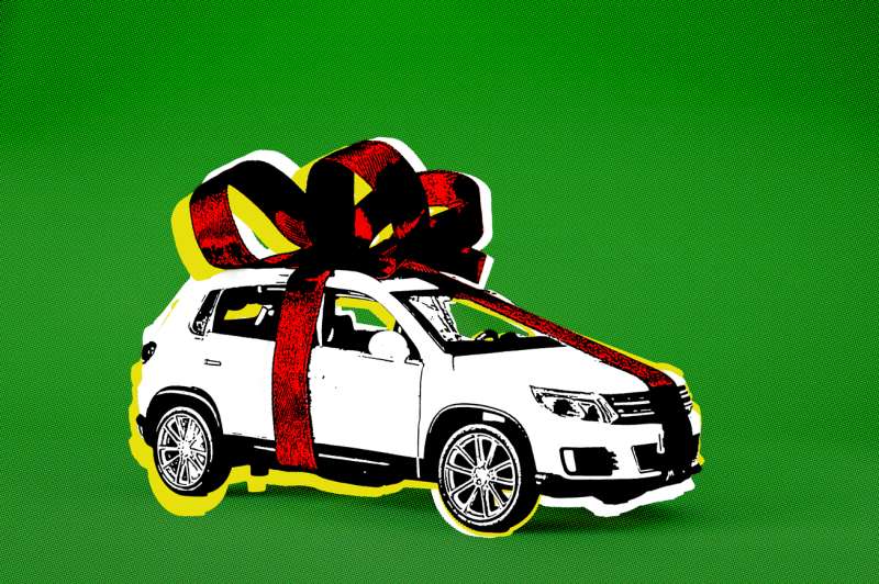 New Car wrapped in a giant red bow on top of a Green background
