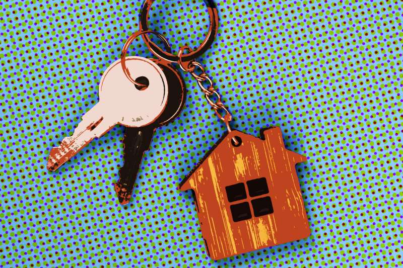 Close-up of keys with a house shaped keychain