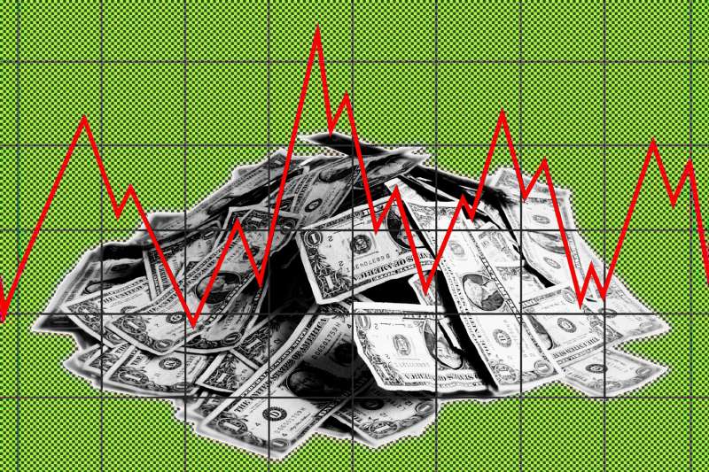 Photo illustration of a stack of dollar bills with a red line graph