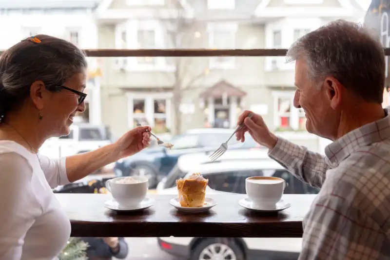 Couple sharing coffee and a pastry in Lancaster
