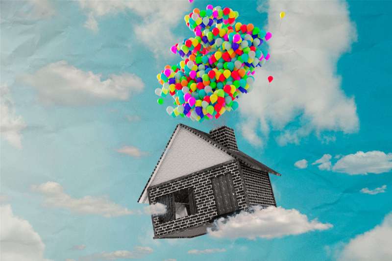 Photo Illustration of small house flying up in the air with balloons attached to the chimney.