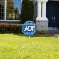 ADT security sign displayed in-front of home
