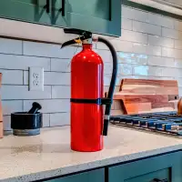 Fire extinguisher on top of a kitchen counter