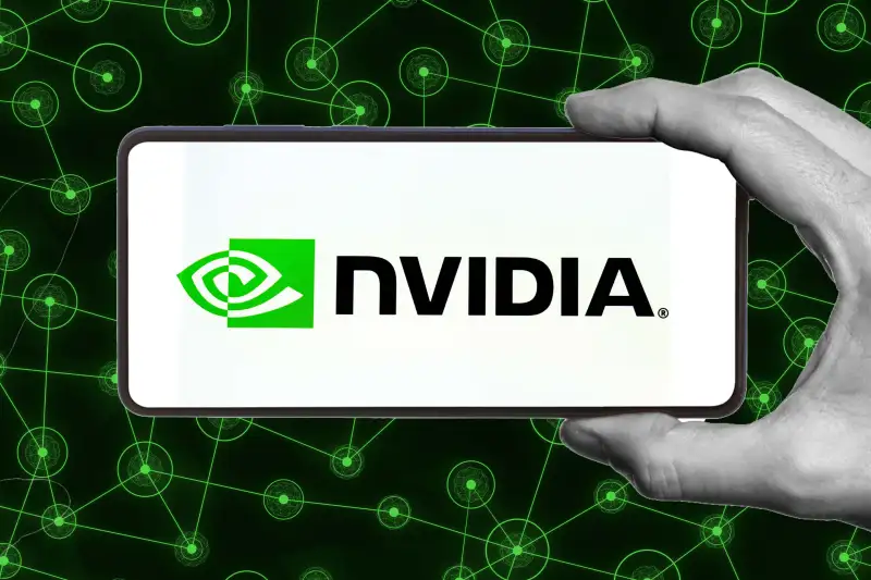 Hand holding phone with 'Nvidia' on the screen